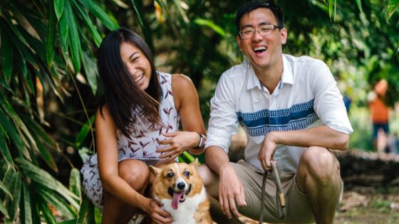 a happy couple with their dog